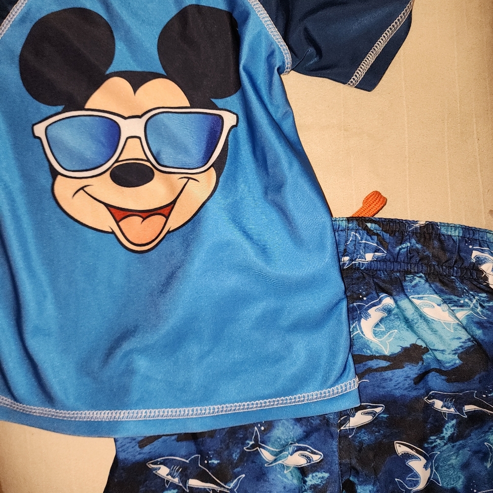 Mickey and sharks swim